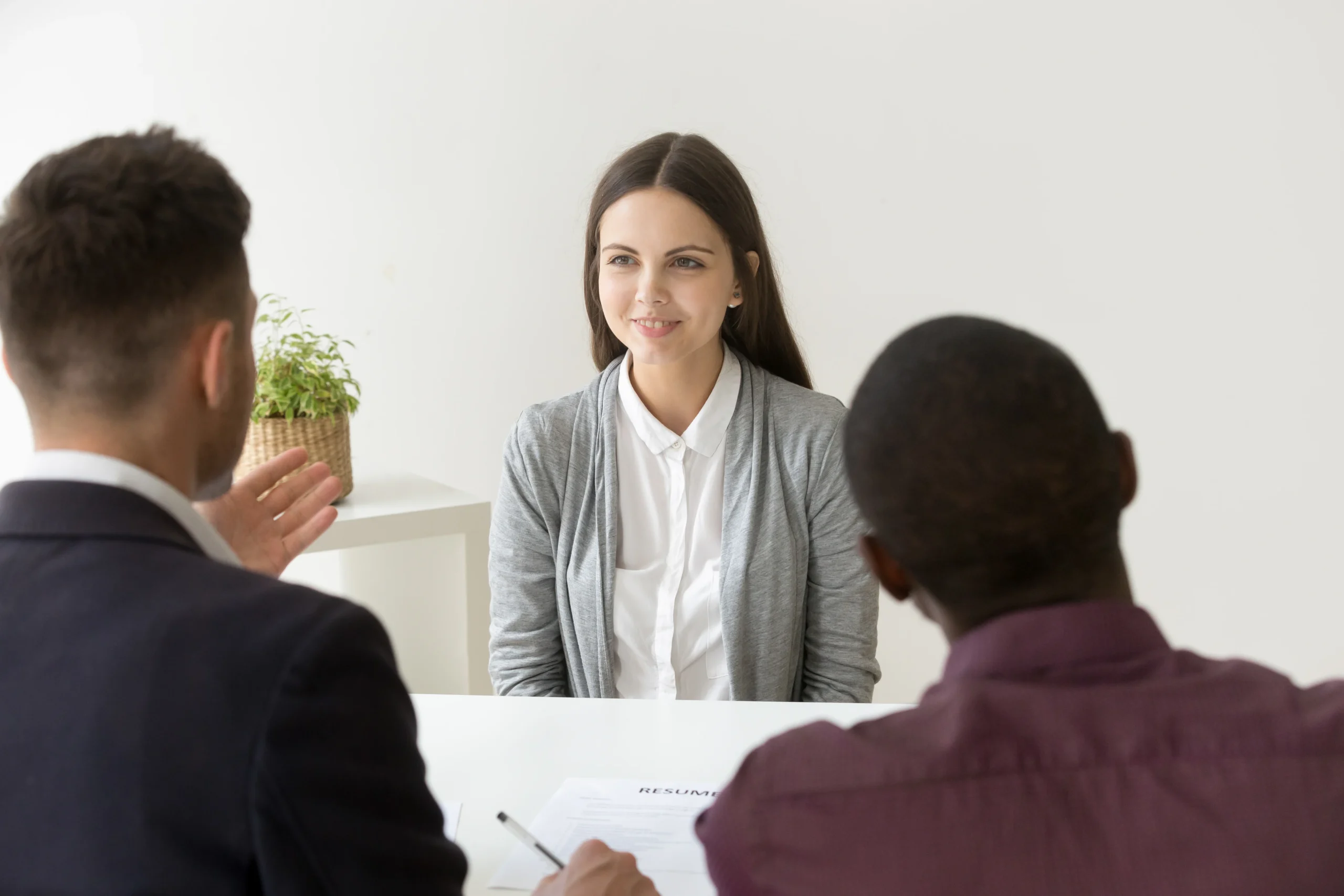 Confident Applicant Smiling Job Interview With Diverse Hr Managers